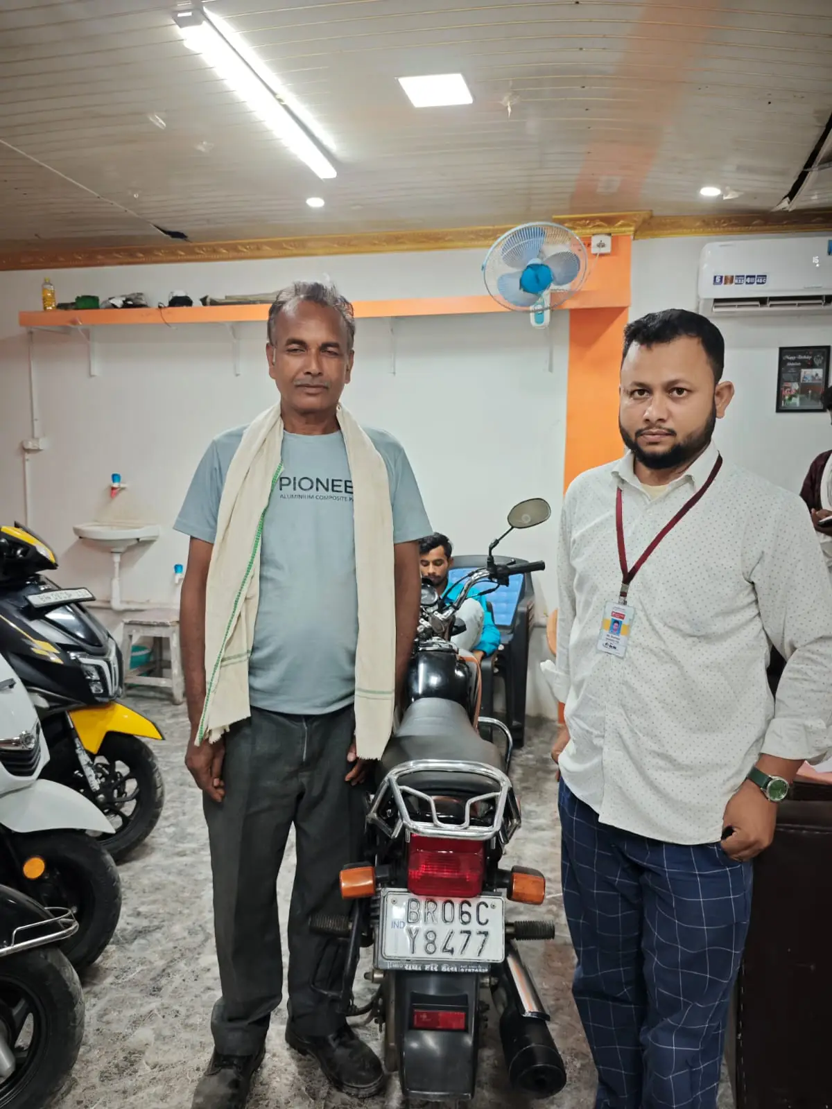 Buyer collecting certified pre-owned motorcycle at Bike Builders Bihar